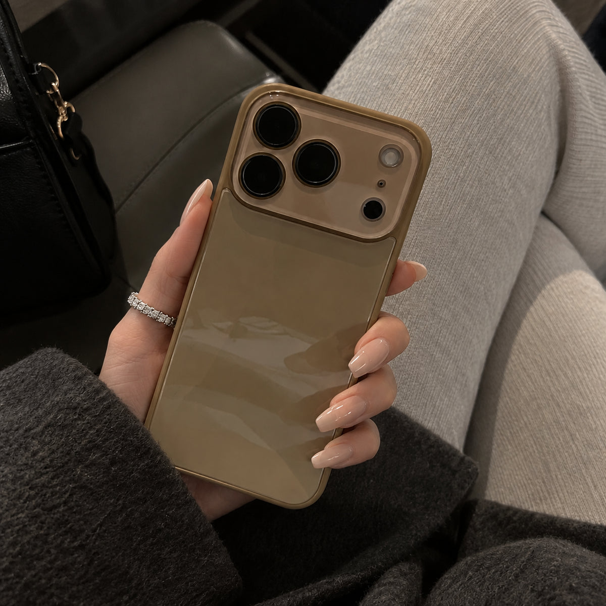 Image showing glossy Taupe Phone in Cozy Seat, featuring iphone slim shockproof case with tempered glass back & camera protection.