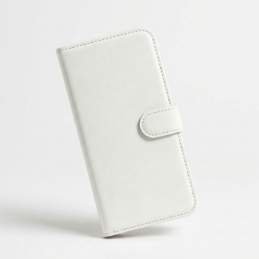 White leather-look wallet phone case standing upright at an angle, showing its plain stitched front cover and rounded closure tab.