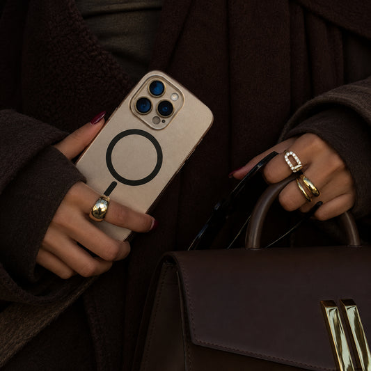 Image showing moody Luxury Phoneand Handbag Still Life, featuring iphone aluminum frame magsafe case with magnetic charging & camera protection.