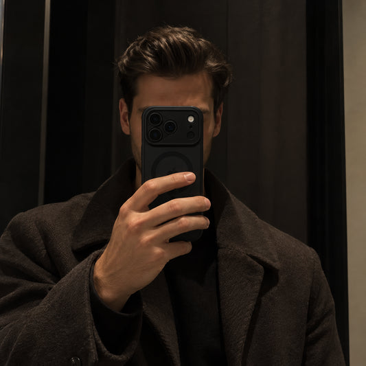 Image showing moody Mirror Selfieina Dark Coat, featuring iphone matte translucent magsafe case with anti-fingerprint & scratch protection.