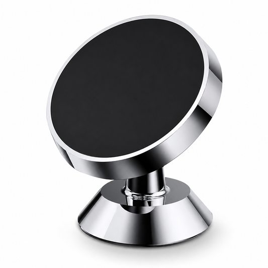 A compact silver-colored phone mount has a black round magnetic face angled above a short ball-joint stem and flared circular base.