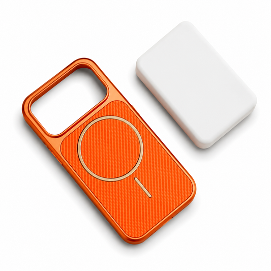 An empty bright orange case lies beside a white rectangular block. Fine diagonal ridges cover the back beneath a metallic magnetic circle and short alignment bar.