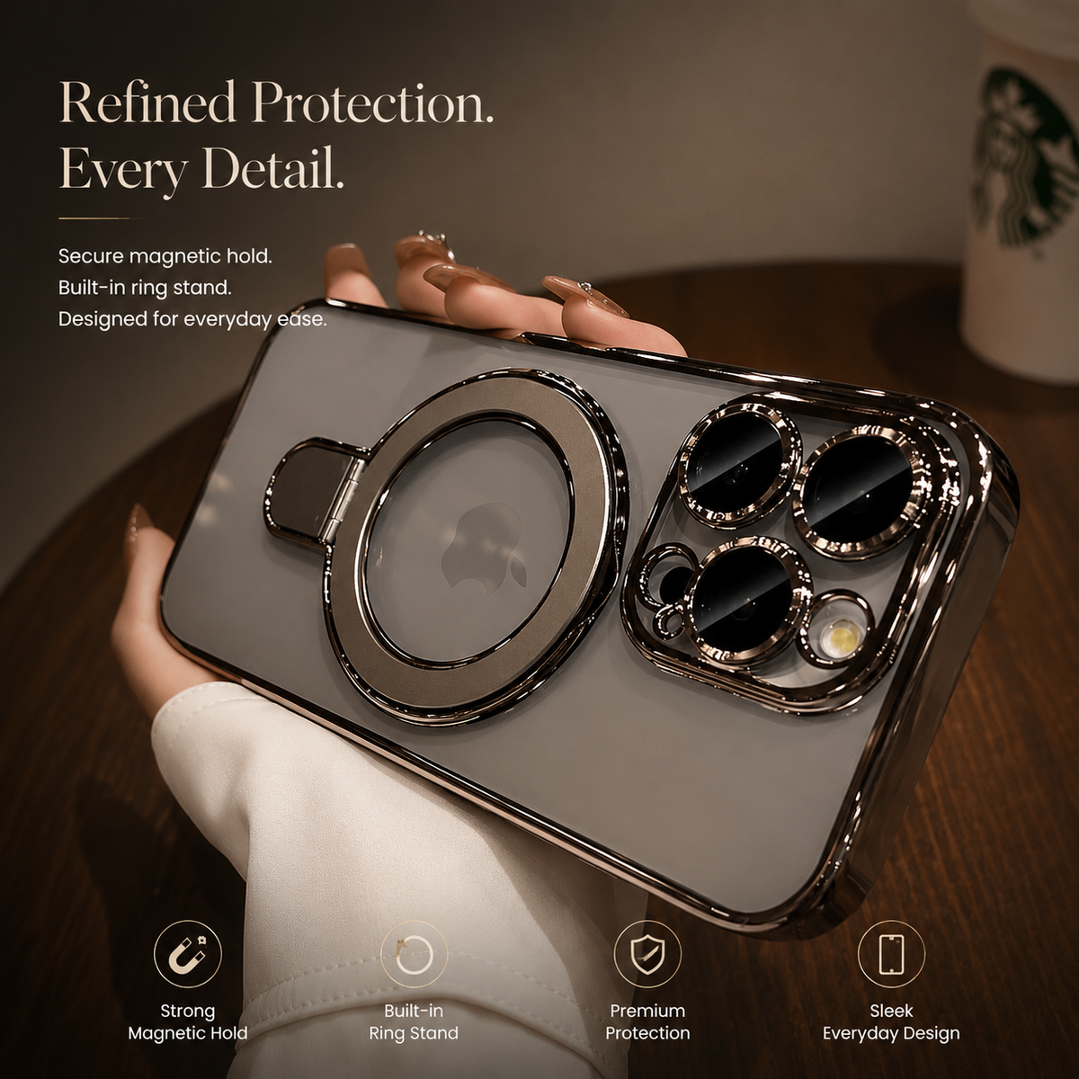 A hand holds a silver-gray clear case horizontally, showing its flat ring stand, Apple logo and raised lens surrounds beside protective-design icons.