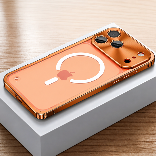 Orange framed case lies face down on a white box, showing a frosted transparent back with a white broken magnetic ring and alignment bar. A broad reflective camera panel surrounds three lenses.