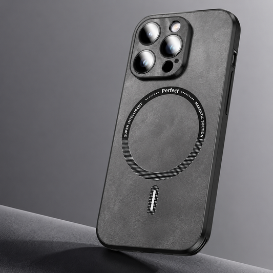 A gray leather-look phone case leans upright on gray fabric. A dotted circular ring and short bar decorate its textured back beneath a raised three-lens camera surround.