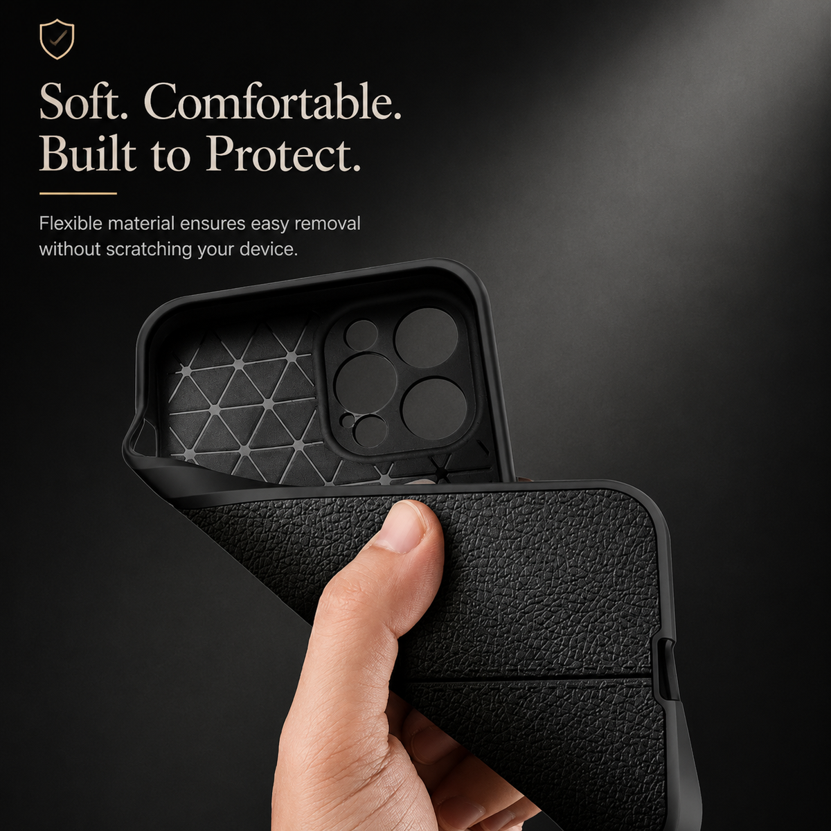 A hand bends a black textured case away from its interior, revealing a triangular grid-like lining beneath Soft. Comfortable. Built to Protect.