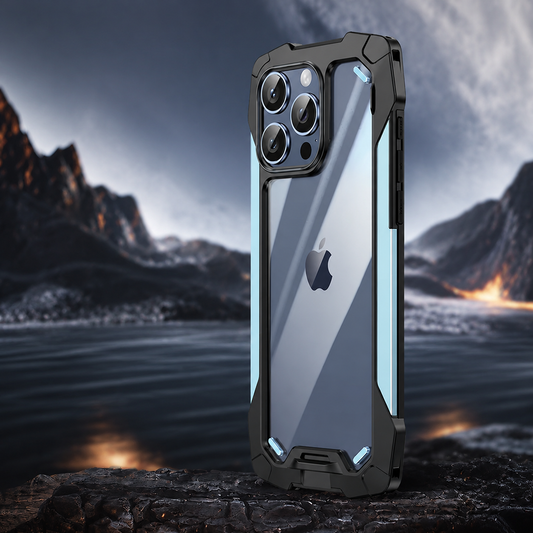 A clear-backed rugged case with pale blue side accents stands on rock before a dark mountain lake. Black corner guards frame the reflective back.