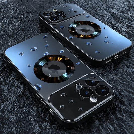 Two glossy dark magnetic phone cases lie diagonally on rough dark stone, with droplets across their backs and reflective rings around the Apple logos.