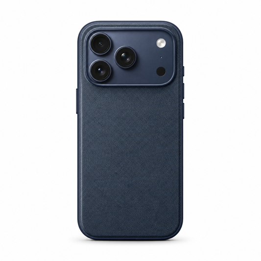 Rear view of a navy blue phone case standing upright against a white background. Its broad back has a fine woven fabric texture, framed by a smooth matching rim. A wide rectangular opening at the top surrounds three camera lenses, flash and sensor. Covered buttons project slightly from the sides.