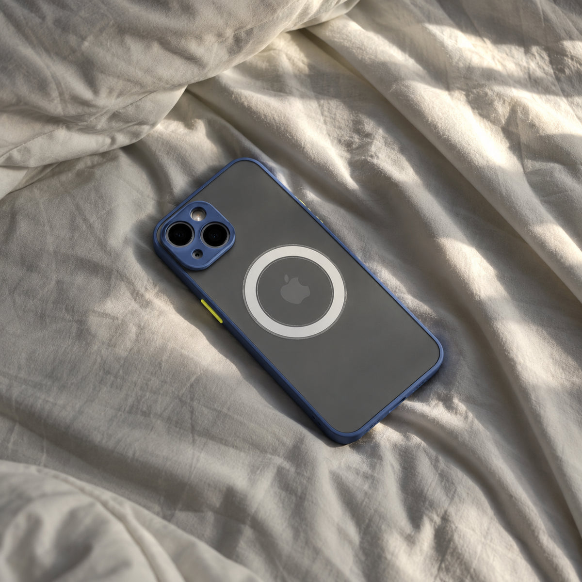 Image showing blue Mag Safe Phone on Sunlit Bedding, featuring iphone hard matte magsafe case with anti-fingerprint finish & slim protection.