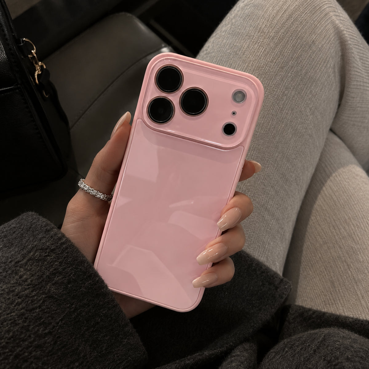 Image showing glossy Pink Phone in Cosy Seat, featuring iphone slim shockproof case with tempered glass back & camera protection.