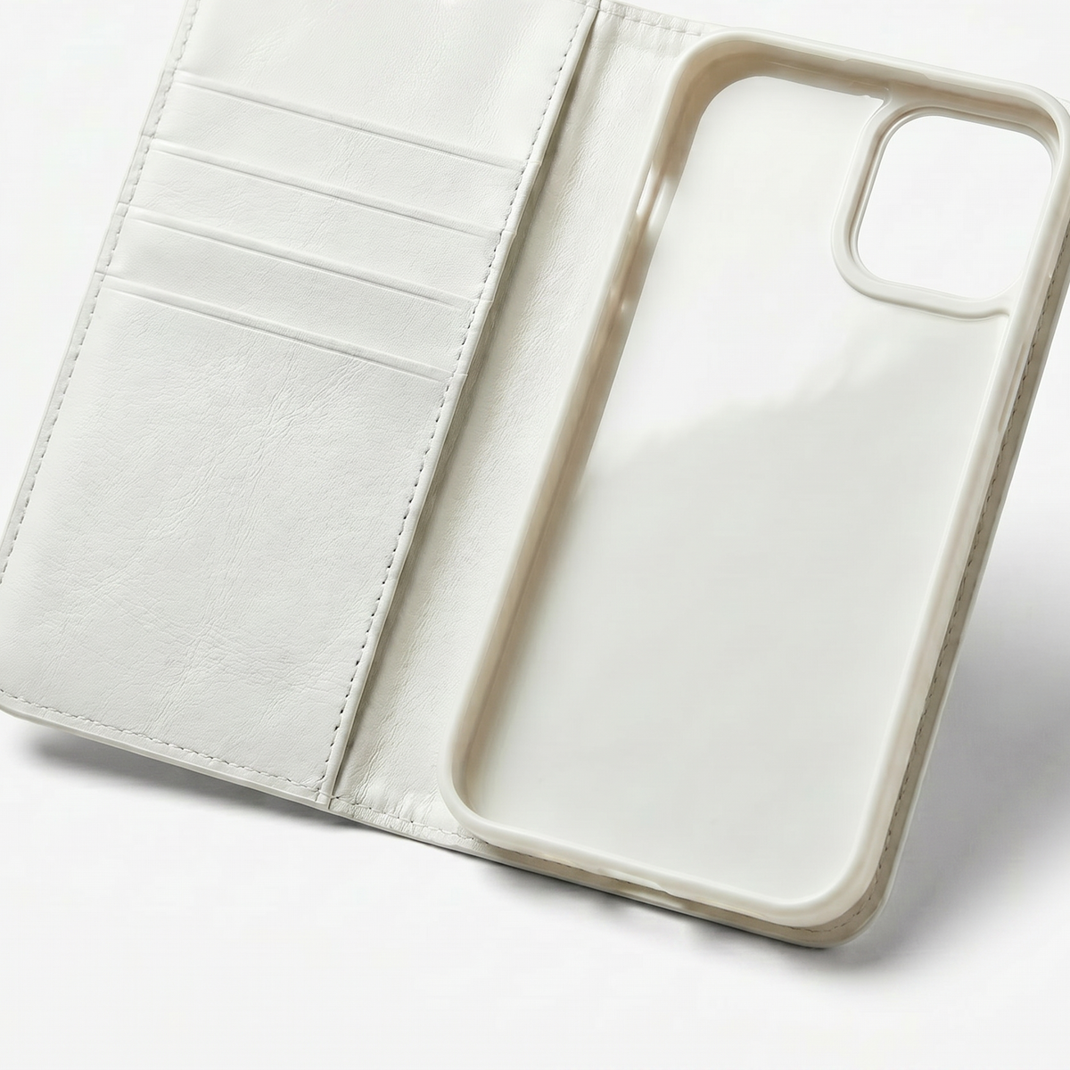 Open white wallet phone case reveals three card slots and a larger pocket on the left, and a cream phone shell with a square camera opening on the right.