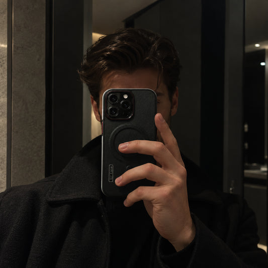 Image showing moody Mirror Selfiewith Textured Phone Case, featuring iphone two-tone leather style magsafe case with matte finish & shockproof protection.