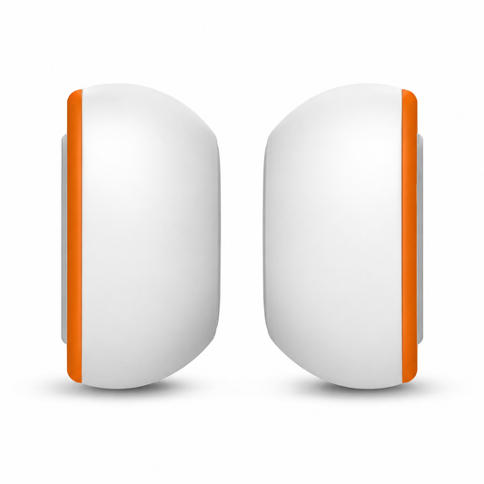 Pair of white replacement ear tips shown side-on, with curved domes and orange foam rings around their attachment edges.