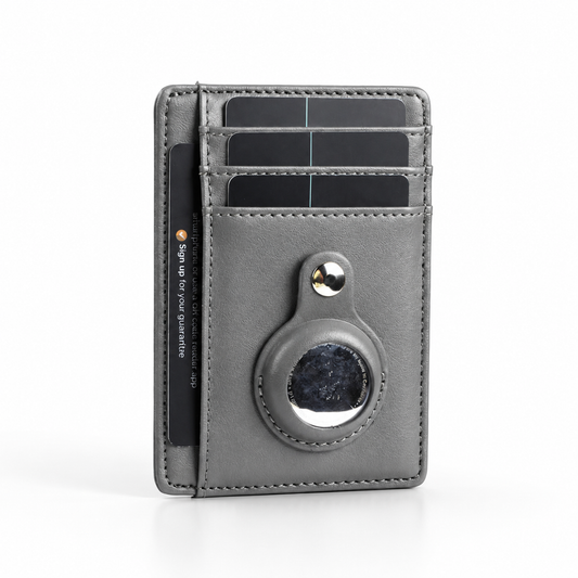Gray stitched card wallet standing upright, with three cards in stacked front slots, a side card pocket and a round tracker held beneath a snap tab.