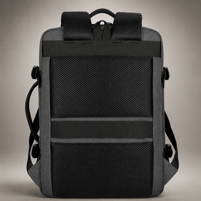 The rear of a charcoal backpack shows broad black mesh padding, padded shoulder straps, top handle and horizontal luggage strap.