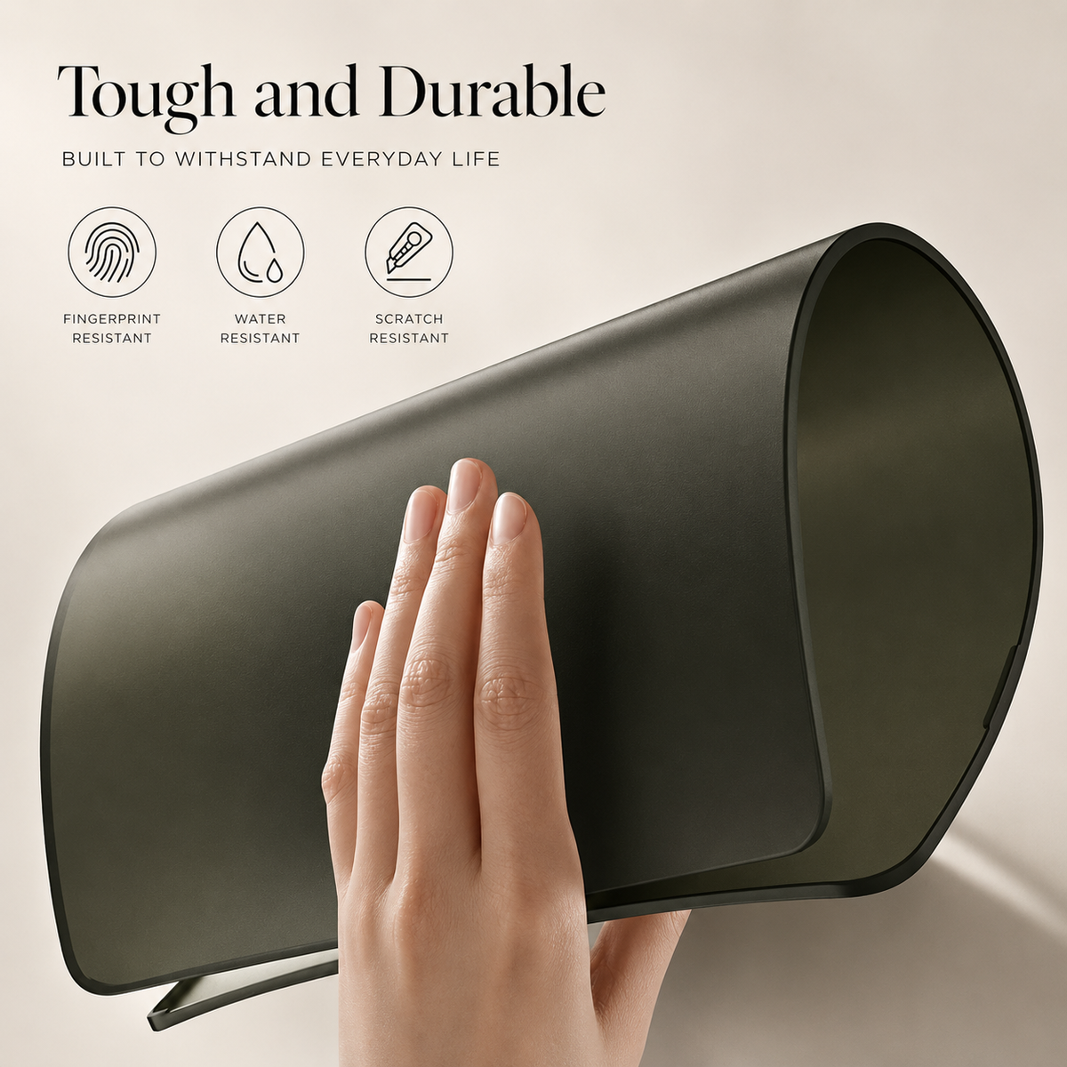 A hand bends an olive green laptop shell into a curve to illustrate flexibility. Icons advertise fingerprint, water, and scratch resistance.