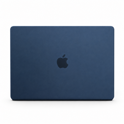 A closed MacBook is shown from behind in a matte navy blue fitted cover, with a dark Apple logo centered on the lid.