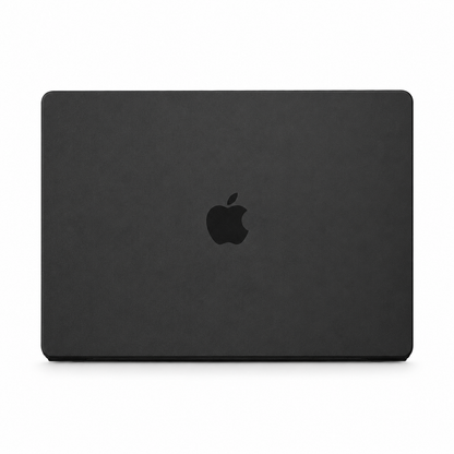 A closed MacBook is shown from behind in a matte charcoal black fitted cover, with a dark Apple logo centered on the lid.
