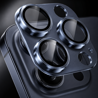 A blue camera protector with three raised transparent lens rings floats close above a matching dark blue phone's camera cluster.