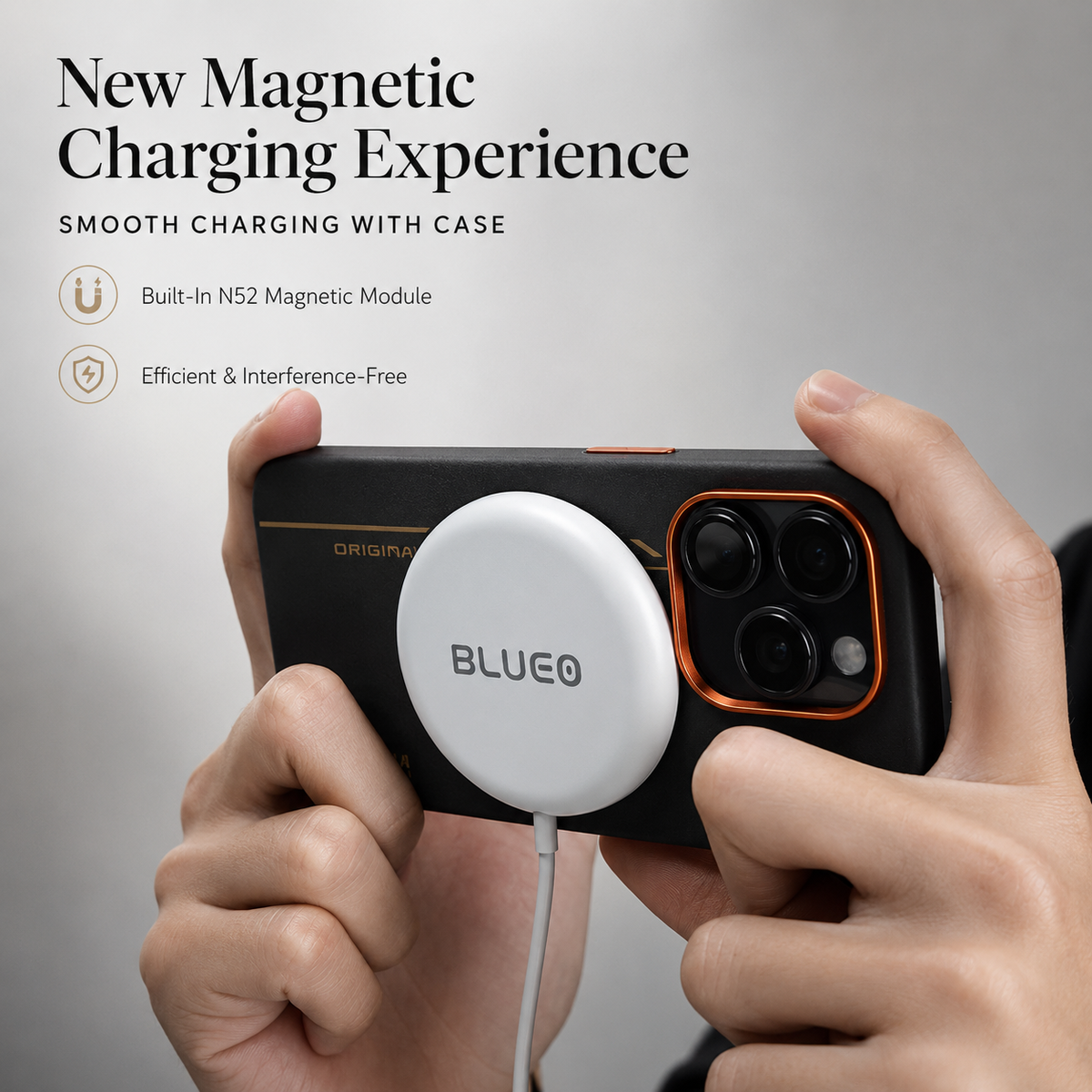 Two hands hold the black and orange case horizontally with a white circular charging puck attached to the rear. A cable hangs below. Text reads New Magnetic Charging Experience and labels an N52 magnetic module.