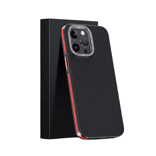 A black diagonal-weave case with red side strips leans against a black rectangular retail box on white. A raised silver-colored ring encloses the camera panel and has small screw-like details around its edge. Colored button covers accent the narrow black rim.