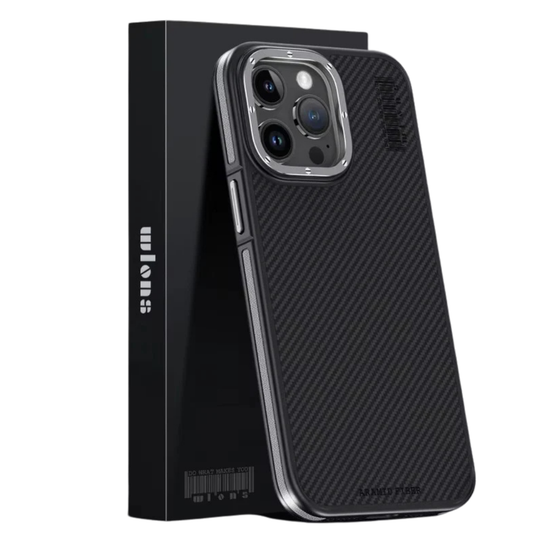 A black diagonal-weave case with silver side accents leans against a tall black retail box on white. A raised silver-colored ring surrounds its camera panel, with small screw-like details around the edge. The slim rim contains separate button covers and matching color strips.