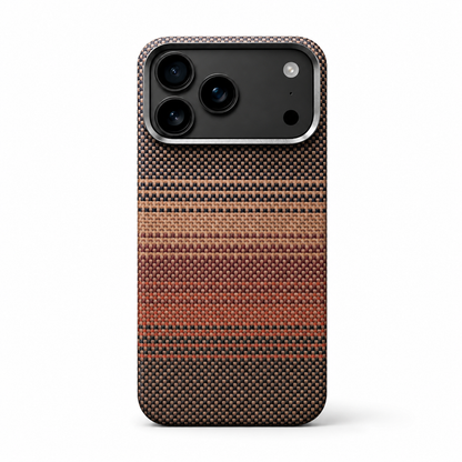 A woven-looking case stands on white, patterned in narrow black, tan, gold and orange horizontal bands beneath a silver-gray camera border.