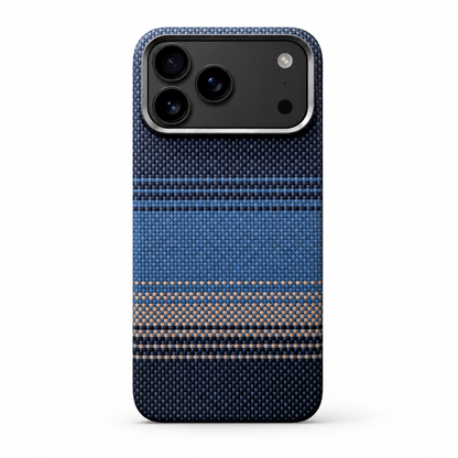 A blue woven-looking case stands upright on white, with dark blue areas, lighter blue horizontal bands and a pale gold stripe beneath its silver-gray camera border.