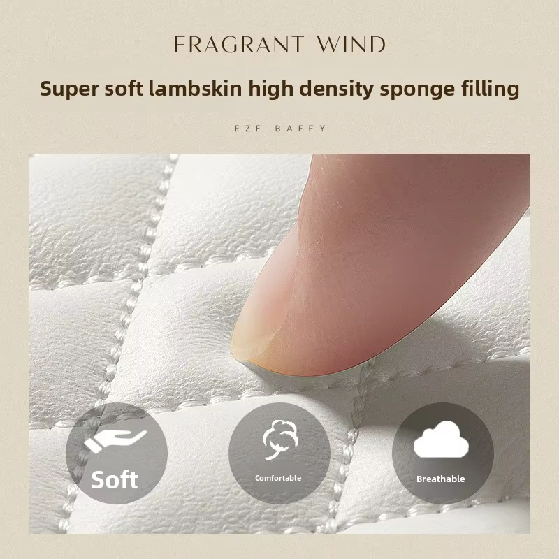 A fingertip presses into a white diamond-quilted surface. Text advertises soft lambskin with high-density sponge filling.