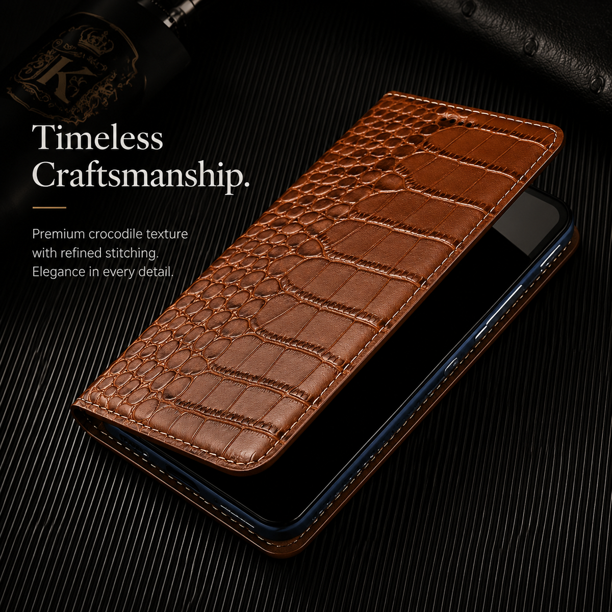 A tan wallet lies partly open above a phone with a dark screen on ribbed black material. Its broad textured scales, narrow fold and stitched rim are visible. Text reads Timeless Craftsmanship.