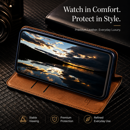 A tan wallet props a phone horizontally on a dark textured surface. The screen shows clouds reflected in water at sunset. Text reads Watch in Comfort. Protect in Style, beside viewing and protection labels.