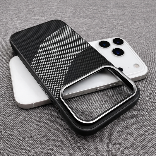 An empty black and silver check-patterned phone case lies across a white phone on gray fabric. Curved bands sweep across the back beneath a large silver-trimmed rectangular camera opening.