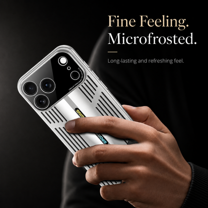 A hand holds a silver slotted case against black with a finger resting on the back. Text advertises a microfrosted feel.