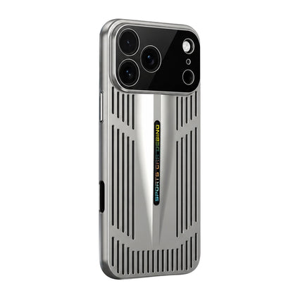 A silver case stands against white, showing a broad glossy black camera panel, long narrow slots and a tapered central ridge with small colorful lettering.