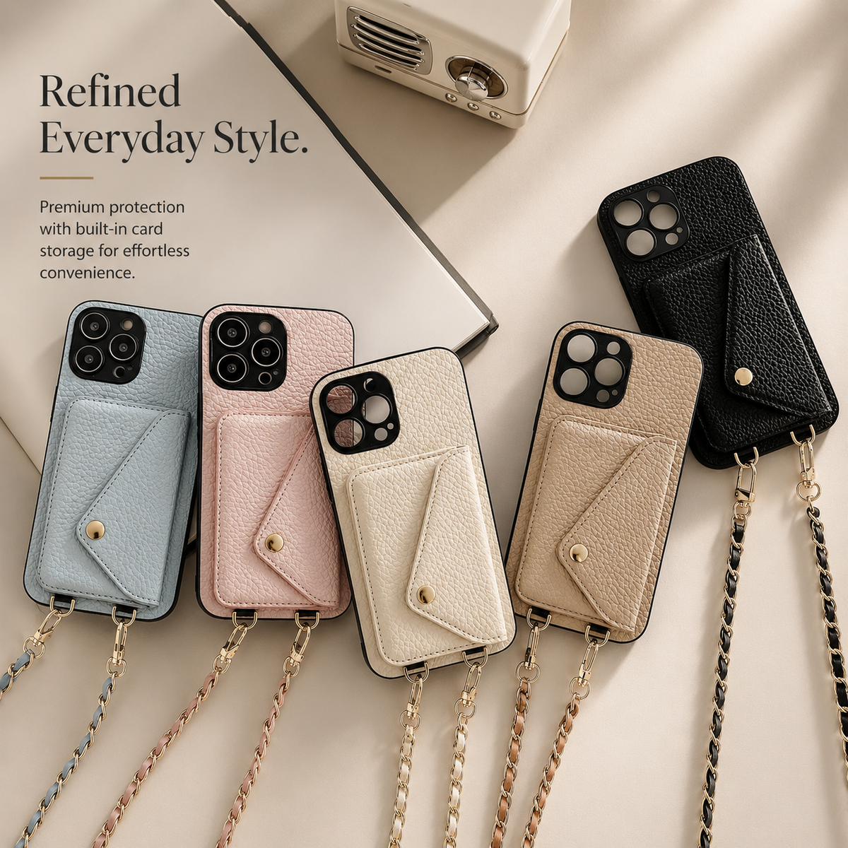 Five pebbled phone wallets arranged on beige in blue, pink, cream, taupe, and black. Their envelope pockets are closed, and woven gold-colored chains trail downward.