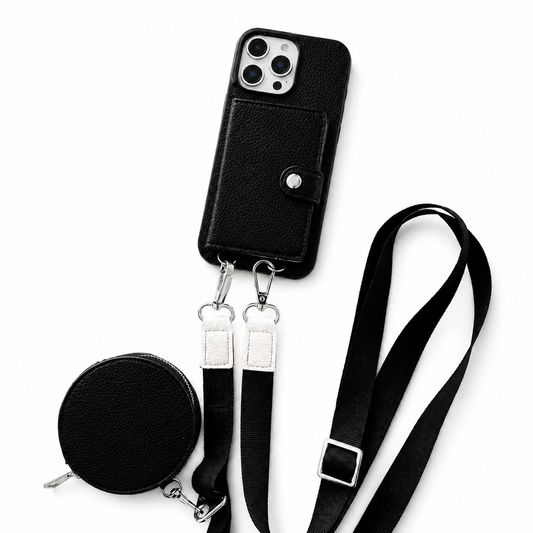 A black pebbled phone case lies on white with a snap-closed rear wallet, long adjustable strap and matching round zippered pouch attached by metal clips.