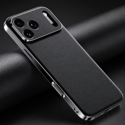 Black finely textured case lies diagonally on folded black material, showing silver-colored sides, covered buttons, and a matching textured camera panel.