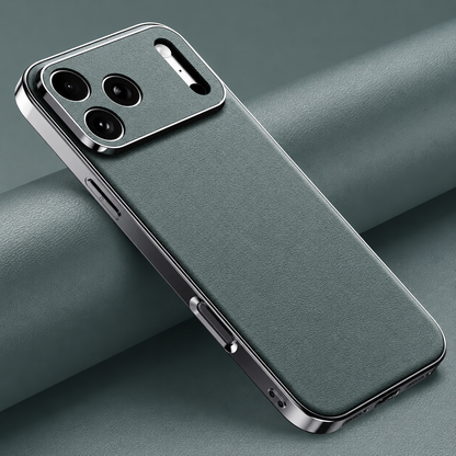 Muted green finely textured case lies diagonally on matching folded material, with reflective silver-colored edges and matching camera panel.