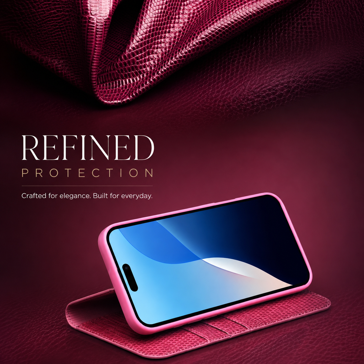 A pink folio case supports a phone horizontally on its folded front cover against burgundy patterned material.