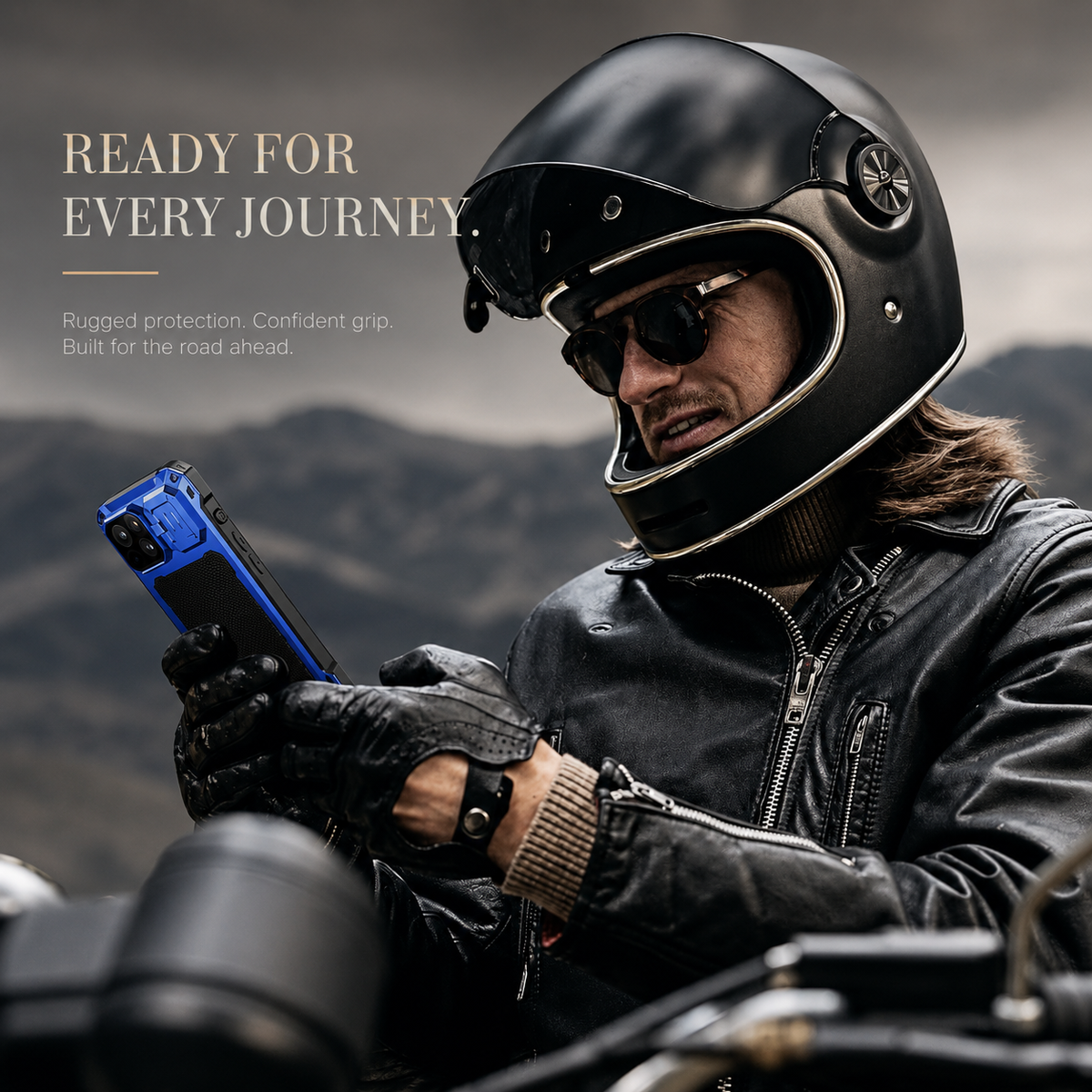 A helmeted motorcyclist in a black leather jacket and gloves looks at a blue rugged phone case outdoors. Text describes protection for travel.
