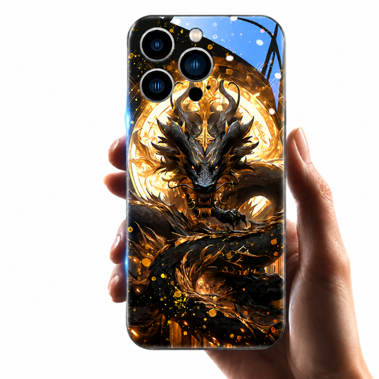 A hand holds a glossy black phone case upright on white. An ornate black dragon coils across the back in front of a glowing gold circular disc, surrounded by fiery gold fragments. Three camera lenses occupy the upper left, with a bright blue window-shaped reflection across the top.