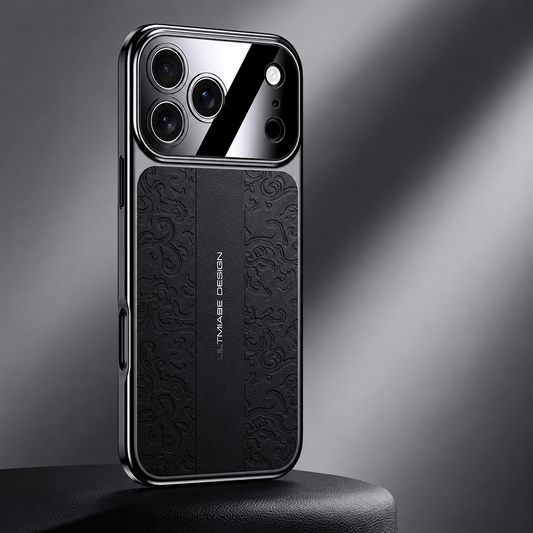 A black embossed case stands on a dark pedestal in diagonal light. Its curled pattern and plain lettered center strip contrast with the mirrored camera panel.