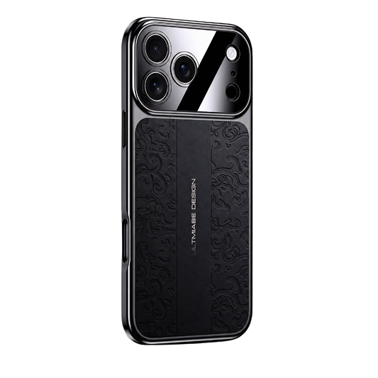 A black embossed case stands on white, showing curled decorative motifs beside a plain central strip with vertical lettering. A glossy camera panel reflects diagonal light.