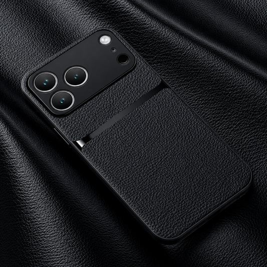 A black pebbled leather-look case rests on matching folded material, showing a narrow glossy horizontal stripe beneath the broad camera panel.