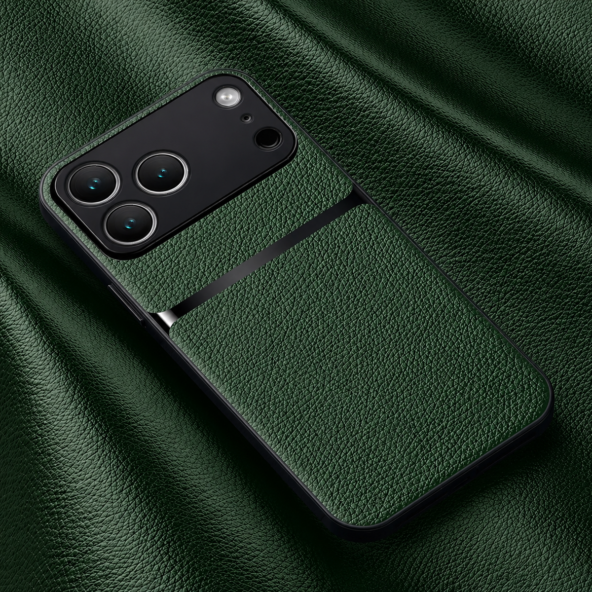 A deep green pebbled leather-look phone case lies on matching material, with a black horizontal stripe beneath its broad black camera panel.