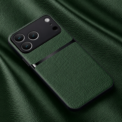 A deep green pebbled leather-look phone case lies on matching material, with a black horizontal stripe beneath its broad black camera panel.