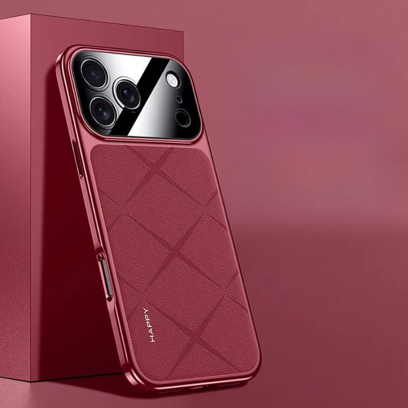 Burgundy diamond-pattern phone case leaning against a matching display block, with reflective red edging and a glossy camera panel.