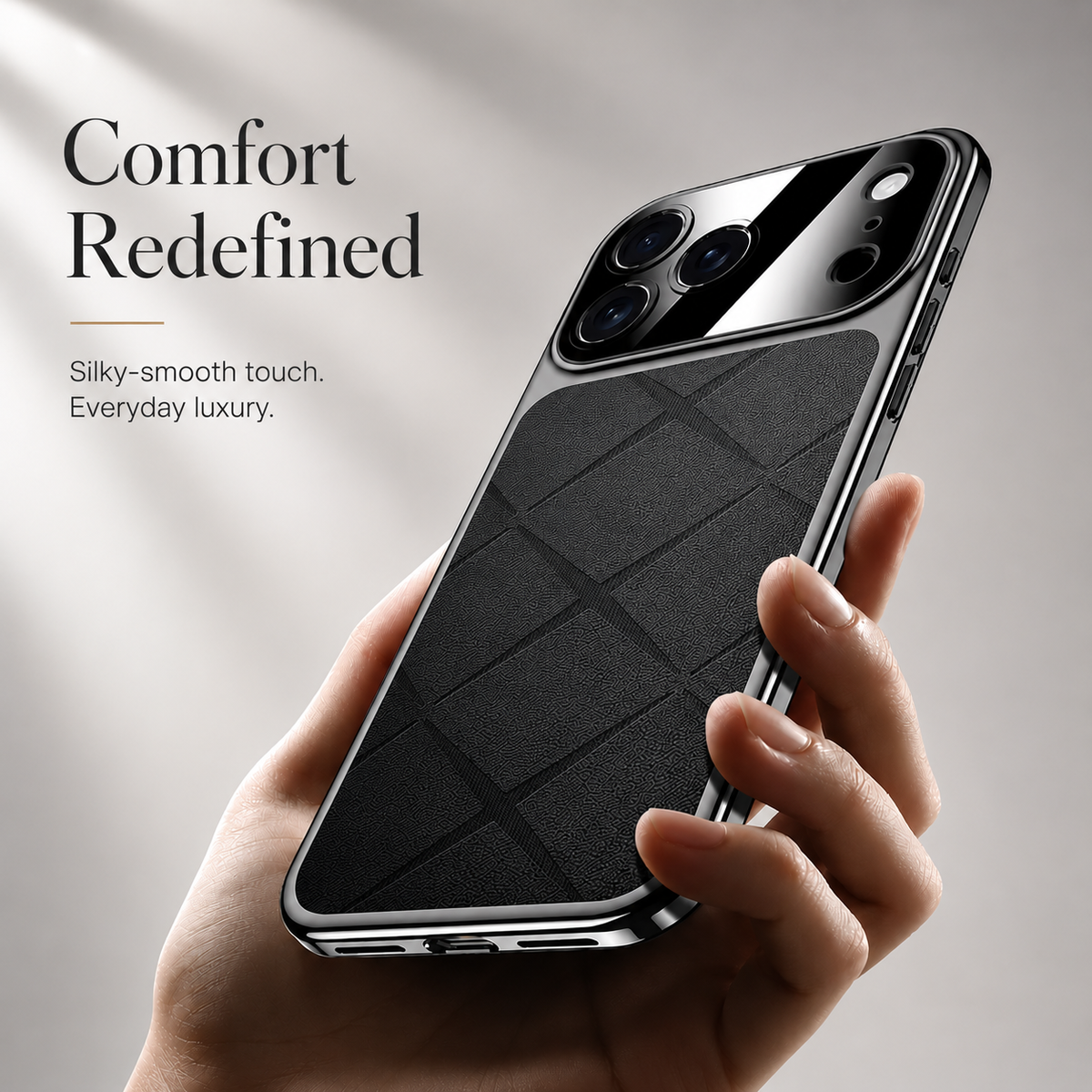A hand holds a black diamond-pattern case at an angle, showing its reflective border and broad glossy camera panel.
