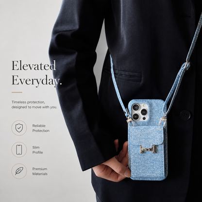 A person in a dark jacket wears a blue pocket case on a matching crossbody strap. The case hangs upright at the front of the hip.